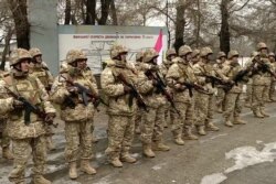 This handout photo taken and released by the Russian Defense Ministry January 12, 2022, shows Armenian soldiers CSTO soldiers guarding an infrastructure facility in Almaty, Kazakhstan.