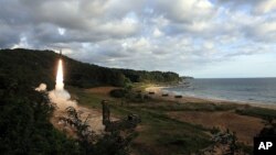 In this photo provided by the South Korea Defense Ministry, South Korea's Hyunmoo II ballistic missile is fired during an exercise at an undisclosed location in South Korea, Sept. 15, 2017.