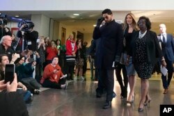 Empire actor Jussie Smollett arrives a news conference after a hearing at the Leighton Criminal Court Building in Chicago, March 26, 2019.