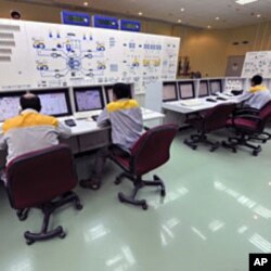 Photo taken August 23, 2010 shows Iranian technicians working at Bushehr nuclear power plant, outside the southern city of Bushehr. Iran's nuclear chief said a malicious computer worm known as Stuxnet has not harmed the country's atomic program and accuse