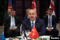 FILE - Turkish Foreign Minister Mevlut Cavusoglu speaks during a meeting in Istanbul, Oct. 29, 2018.