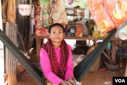 Pen Samath, 52, who owns a small shop along the road in Chantrey commune, said she cannot communicate with ex-opposition officials anymore. Feb. 14, 2018 (Sun Narin/VOA Khmer)