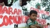 FILE - Anti-communist protesters outside the presidential palace in Jakarta in 2001. 