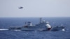 Chinese ship and helicopter are seen during a search and rescue exercise near Qilian Yu subgroup in the Paracel Islands, which is known in China as Xisha Islands, South China Sea, July 14, 2016.