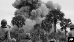 Smoke rises from bombs dropped by U.S. planes near the Cambodian capital of Phnom Penh July 25, 1973. Communist led insurgents surrounding Phnom Penh shelled the city July 25 from as close as four miles.