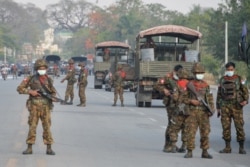 Myanmar soldiers stand guard