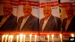 Candles, lit by activists, protesting the killing of Saudi journalist Jamal Khashoggi, are placed outside Saudi Arabia's consulate, in Istanbul, during a candlelight vigil, Oct. 25, 2018.