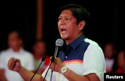FILE - Philippines Vice-Presidential candidate BongBong Marcos talks to supporters during an election campaign in the mountain resort of Baguio city in northern Philippines, April 16, 2016.