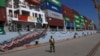 FILE - A Pakistan Navy soldier stands guard next to a loaded Chinese ship, at Gwadar port, about 700 kilometers (435 miles) west of Karachi, Pakistan, Nov. 13, 2016. 