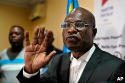 Opposition candidate Martin Fayulu speaks to the press at his headquarters in Kinshasa, Congo, Jan. 10, 2019. Fayulu, who came second in the presidential poll behind Felix Tshisekedi, called the results fraudulent.