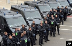 Police officers prepare for a rally in Chemnitz, eastern Germany, Sept. 1, 2018.