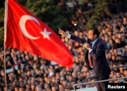 FILE - Newly elected Mayor of Istanbul Ekrem Imamoglu addresses his supporters outside the City Hall in Istanbul, Turkey, April 17, 2019.