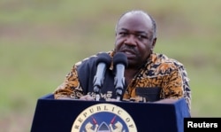 FILE - Gabon's President Ali Bongo addresses reporters at Nairobi National Park near Nairobi, Kenya, Apr. 30, 2016.