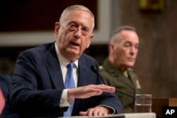 FILE - Defense Secretary Jim Mattis speaks on Afghanistan before the Senate Armed Services Committee on Capitol Hill in Washington, Oct. 3, 2017.