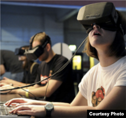 Students use virtual reality for an immersive educational experience. VR blocks out the physical world and transports the user to a simulated world. (Courtesy Dell.com)