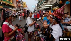 FILE - Vendors sell trinkets in a tourist district of Khao San Road in Bangkok, Thailand, May 27, 2014. Thailand had the 11th highest trade surplus with the U.S. at nearly $19 billion last year.