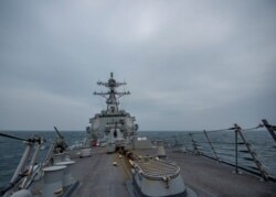 United States Navy Arleigh Burke-class guided-missile destroyer USS John Finn (DDG 113) transits the Taiwan Strait March 10, 2021 in this handout provided by the U.S. Navy. (Jason Waite/U.S. Navy/Handout via REUTERS)