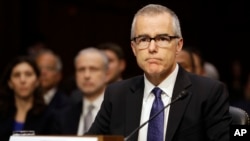 FILE - Acting FBI Director Andrew McCabe listens on Capitol Hill in Washington, May 11, 2017, while testifying before a Senate Intelligence Committee hearing on major threats facing the U.S.