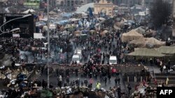 People visit makeshift memorials to the victims of the recent clashes in central Kiyv on February 23, 2014.