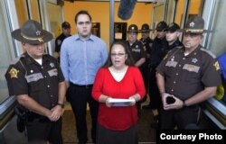 Kim Davis is at the center of same-sex marriage debate by refusing to sign a marriage license.