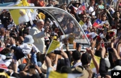 Pope Francis arrives on the pope-mobile to the Maquehue Air Base, to celebrate a Mass in Temuco, Chile, Jan. 17, 2018.