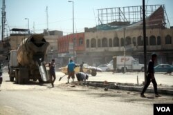 Construction is underway in East Mosul, with many roads and buildings already fixed. But officials say the distruction from IS and the war was so extensive, they don't know how long it will take to rebuild, or how much it will cost, June 8, 2017. (H. Murdock/VOA)