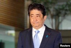 Japan's Prime Minister Shinzo Abe arrives at his official residence in Tokyo, Japan, in this photo taken by Kyodo, May 14, 2017, after South Korea's military said that North Korean had fired an unidentified projectile from a region near its west coast. (Kyodo/via REUTERS)