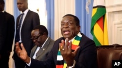 FILE - Zimbabwean President elect Emmerson Mnangagwa addresses a press conference in Harare, Aug, 3, 2018.