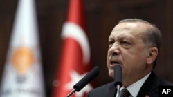 Turkey's President Recep Tayyip Erdogan addresses lawmakers at the parliament in Ankara, Turkey, Jan. 9, 2018.