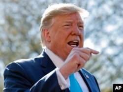 President Donald Trump speaks to members of the media on the South Lawn of the White House in Washington, before boarding Marine One helicopter, April 10, 2019.