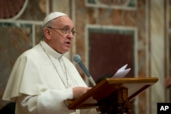 FILE - Pope Francis meets ambassadors to the Holy See, at the Vatican, Jan. 13, 2014.