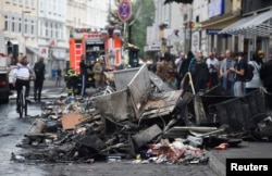 Damage is seen on a street after demonstrations at the G-20 summit in Hamburg, Germany, July 8, 2017.