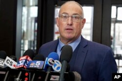 R. Kelly's defense attorney, Steve Greenberg, speaks to reporters at the Leighton Criminal Courthouse after the R&B singer entered a not guilty plea to all 10 counts of aggravated criminal sexual abuse, Feb. 25, 2019.