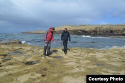 Paleontologist Steve Brusatte, right, and colleague Tom Challands on the Isle of Skye in Scotland where the massive dinosaur tracks were found. (Credit. Mark Wilkinson, University of Edinburgh)