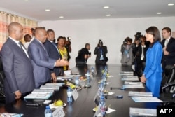 U.S. Ambassador to the United Nations Nikki Haley (R), meets Democratic Republic Congo's national independent electoral commission's president, Corneille Nangaa Yobeluo, at the commission's headquarters in Kinshasa, DRC, Oct. 27, 2017.