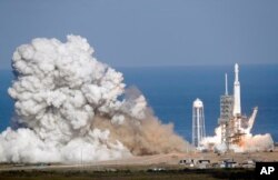 The Falcon Heavy has three first-stage boosters, strapped together with 27 engines in all.