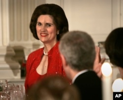 FILE - Linda Robb is recognized by then-President George W. Bush during a toast at a dinner celebrating the 40th anniversary of the National Endowment for the Arts and the National Endowment for the Humanities in the State Dinning Room of the White House, Nov. 10, 2005, in Washington. Linda Robb's father, Lyndon B. Johnson, started the endowments under his presidency.
