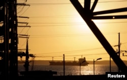 A fuel tanker travels near the Cienfuegos Oil Refinery some 240 kilometres, (150 miles), southeast of Havana, Feb. 7, 2013.