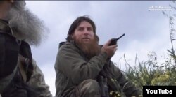 This screengrab from a YouTube video shows one the most prominent and recognizable foreign fighters in Syria, Chechen Jisr ash-Shugur, known as Muslim Shishani, leader of the Islamist Junud Ash Sham group, at Jisr ash-Shugur, April 21, 2015.
