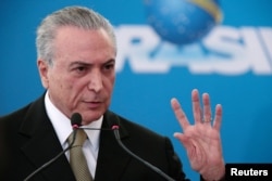FILE - Michel Temer speaks at the Planalto Palace in Brasilia, June 1, 2016.
