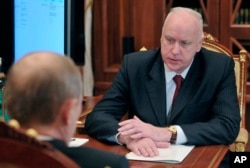 Russian President Vladimir Putin, left, meets with Investigative Committee Chief Alexander Bastrykin in the Kremlin in Moscow, Dec. 13, 2012.