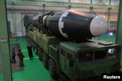 FILE - North Korea's leader Kim Jong Un is seen as the newly developed intercontinental ballistic rocket Hwasong-15's test was successfully launched, in this undated photo released by North Korea's Korean Central News Agency in Pyongyang, Nov. 30, 2017.