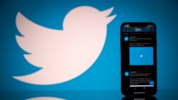 In this file photo taken on October 26, 2020 this photograph shows the logo of US social network Twitter displayed on the screen of a smartphone and a tablet in Toulouse, southern France. (AFP)