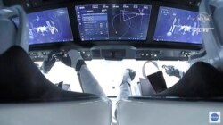 In this image from video made available by NASA, astronauts in the SpaceX Dragon capsule approach the International Space Station, Nov. 11, 2021.