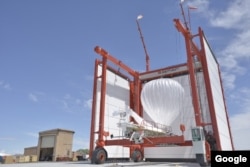A Project Loon balloon is readied for launch.