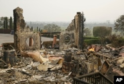 The remains of the Signorello Estate winery continue to smolder in Napa, Calif., Oct. 10, 2017.