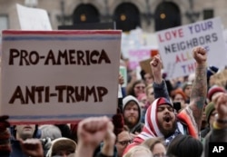 FILE - Demonstrators rally against President Donald Trump in Boston, Jan. 29, 2017.
