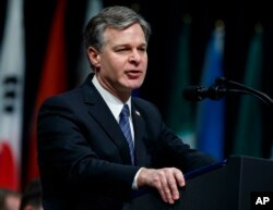 FILE - FBI Director Christopher Wray speaks during the FBI National Academy graduation ceremony, Dec. 15, 2017, in Quantico, Va.