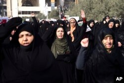 FILE - Iranian protesters chant slogans at a rally in Tehran, Iran, Dec. 30, 2017. Iranian hard-liners rallied to support the country's supreme leader and clerically overseen government as spontaneous protests by critics of the government broke out across the country.