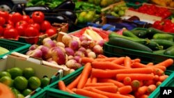 Fresh assorted vegetables in boxes at a farmers' market. (FILE PHOTO)